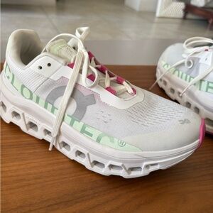 On Running White Sneakers with Pink Highlights